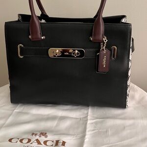 Coach modern sophisticated bag. Black leather with b&w python pattern sides